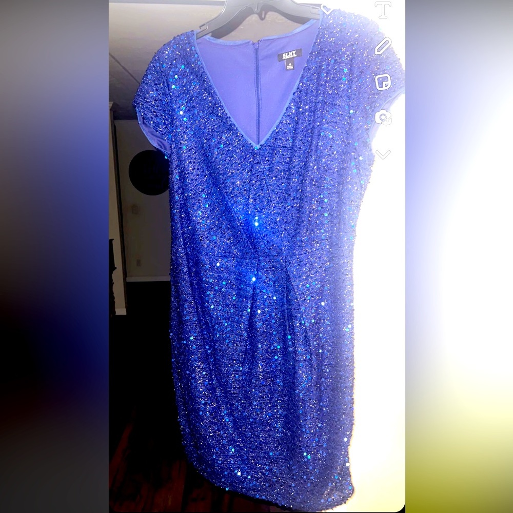 Purchased this party dress for a wedding. Was worn for 2 hours.